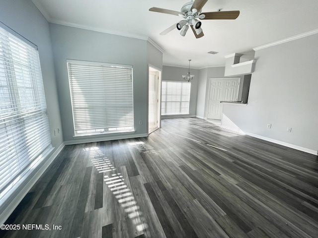 unfurnished living room with crown molding, plenty of natural light, and dark hardwood / wood-style flooring