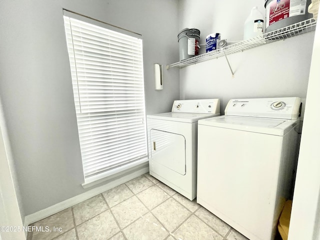 laundry area with light tile patterned flooring and independent washer and dryer