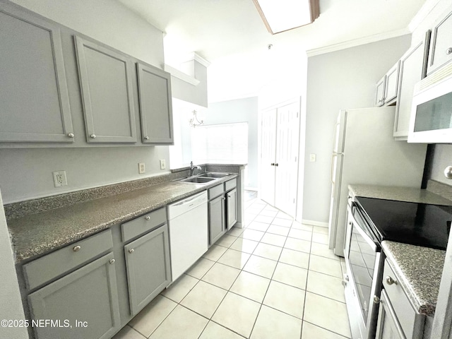 kitchen with light tile patterned flooring, sink, gray cabinetry, crown molding, and white appliances