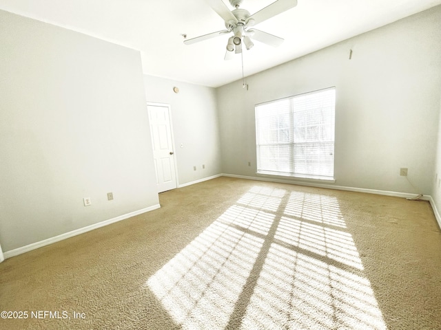 carpeted empty room with ceiling fan