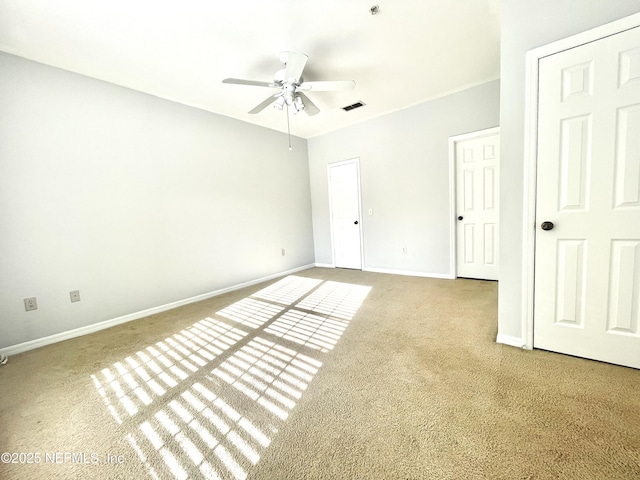 unfurnished bedroom with ceiling fan and carpet