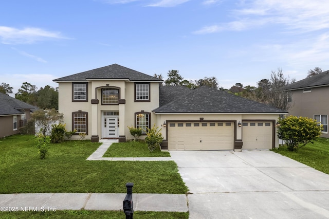 view of front of house featuring a front yard and a garage