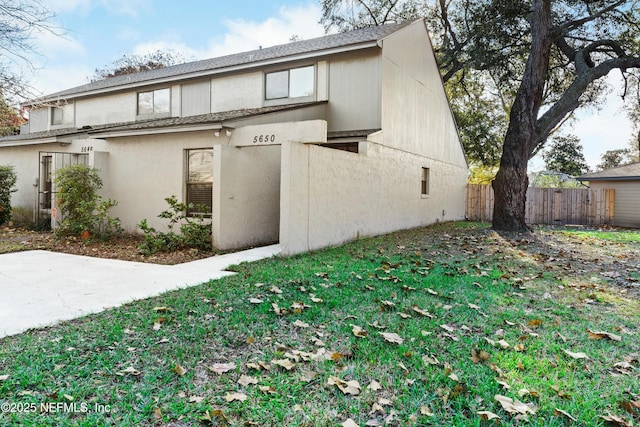 view of side of property with a yard