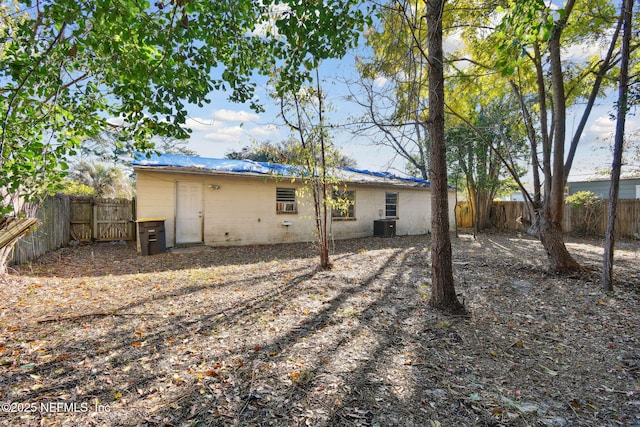 back of property featuring central air condition unit