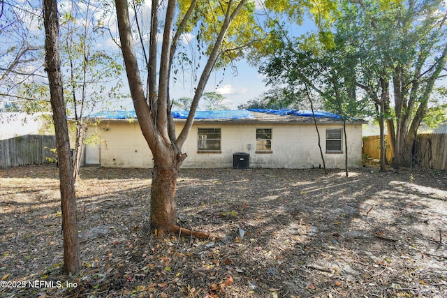 rear view of house with central air condition unit