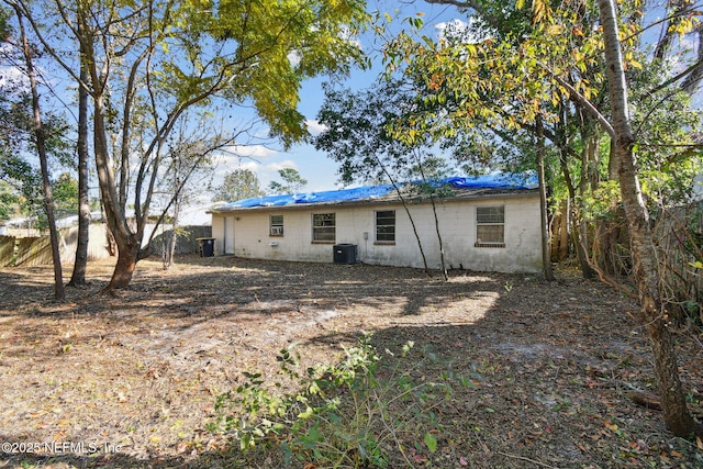 back of property with central air condition unit