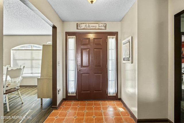 entryway featuring a textured ceiling