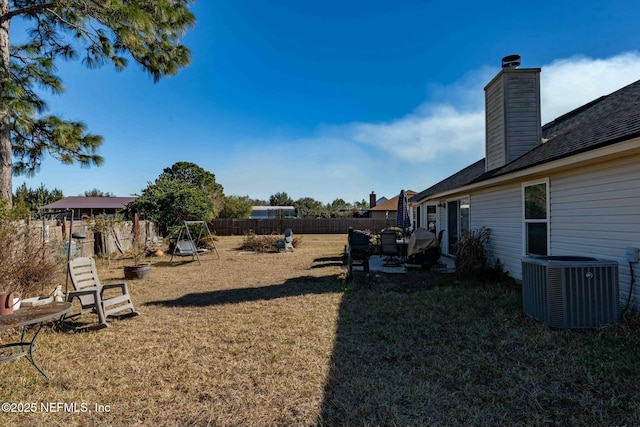 view of yard featuring central AC unit