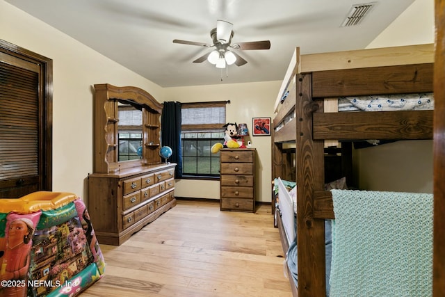 bedroom with ceiling fan and light hardwood / wood-style flooring