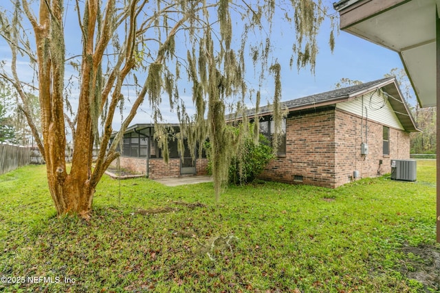 view of yard featuring a patio area and central AC unit