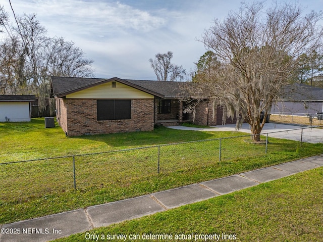 view of front of property featuring central AC unit and a front lawn