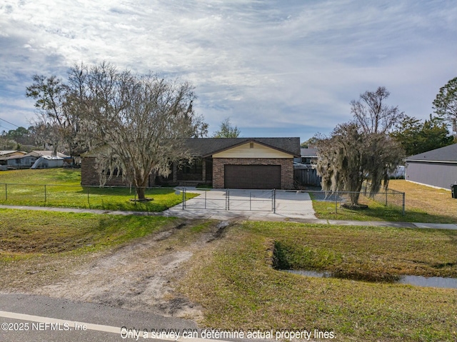 view of front facade featuring a garage and a front lawn