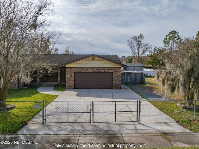 view of front of property with a front yard and a garage