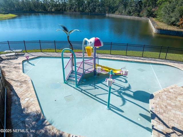 view of pool with a water view