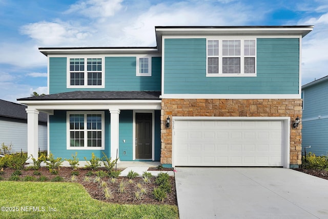 view of front of home with a garage