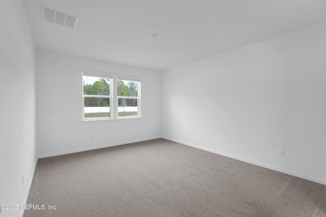 empty room featuring carpet flooring