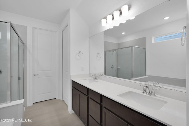 bathroom with walk in shower and vanity