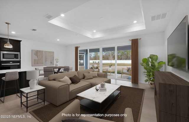 living room with crown molding and a tray ceiling