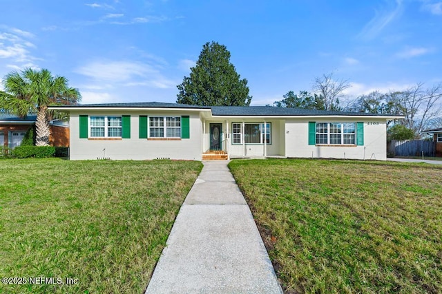 ranch-style home with a front lawn