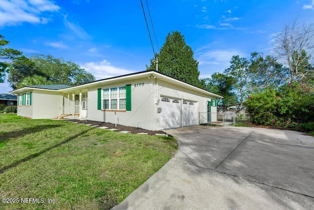 view of side of property with a yard and a garage