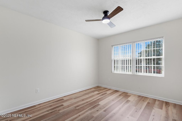 unfurnished room featuring ceiling fan and light hardwood / wood-style floors