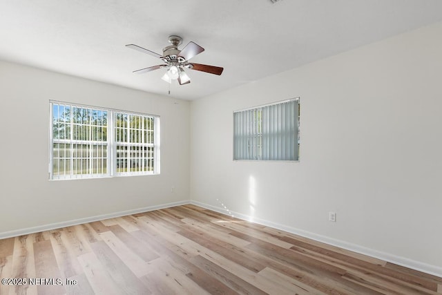 spare room featuring ceiling fan and light hardwood / wood-style flooring