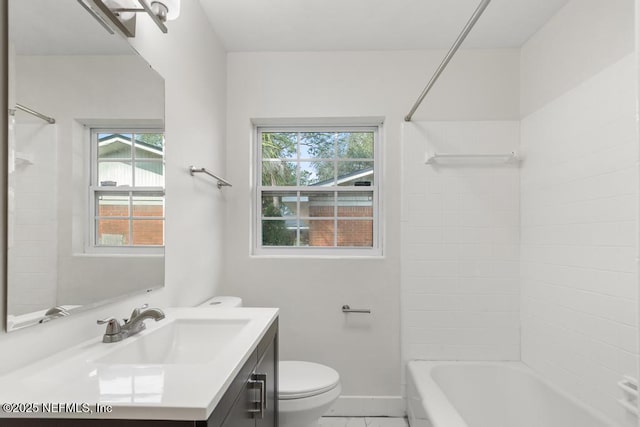 full bathroom featuring vanity, toilet, and tiled shower / bath combo