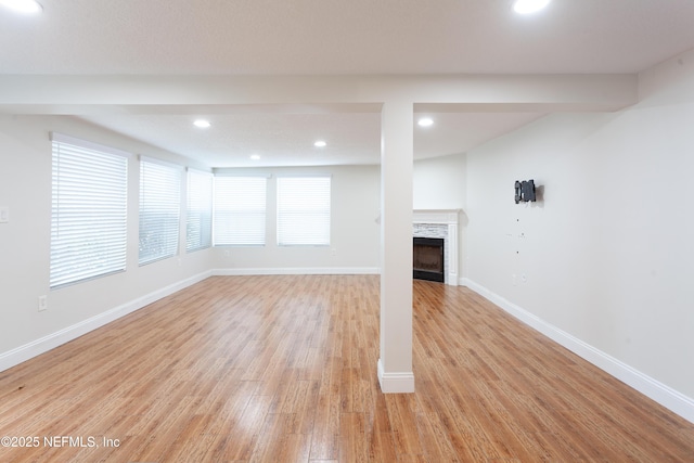 unfurnished living room featuring light hardwood / wood-style flooring