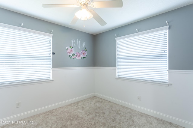 unfurnished room with a wealth of natural light and ceiling fan