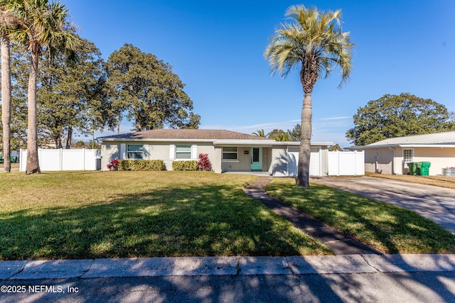 ranch-style home featuring a front yard