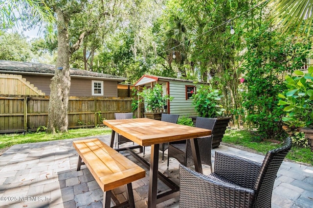 view of patio / terrace with a storage unit