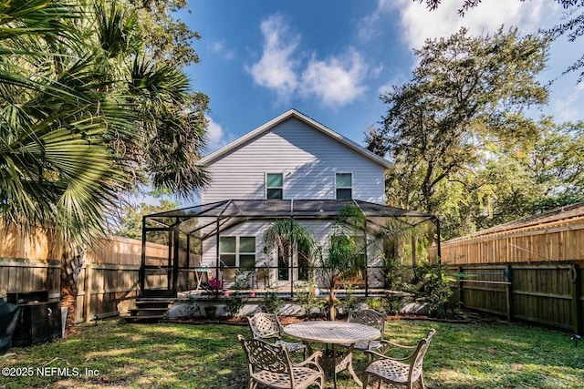 back of house featuring a yard