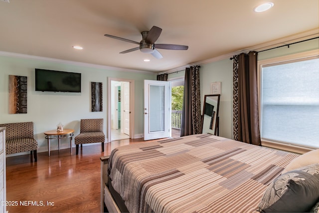 bedroom with dark wood-type flooring, crown molding, and access to exterior