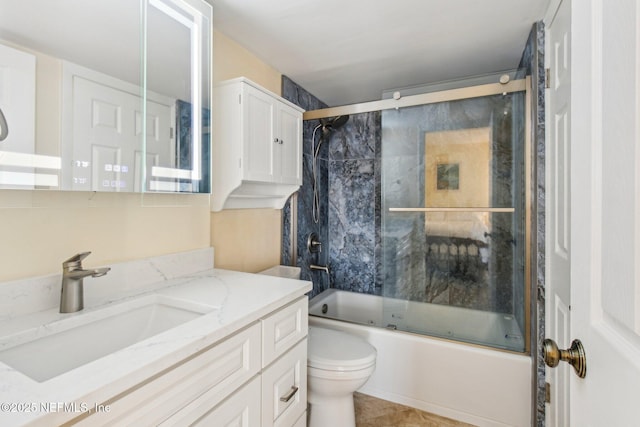 full bathroom with vanity, toilet, and enclosed tub / shower combo