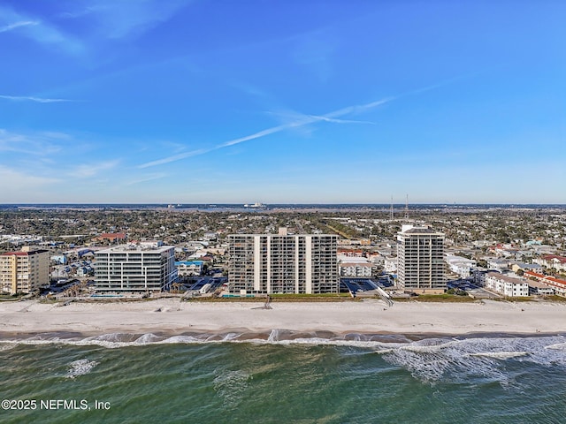 bird's eye view featuring a water view and a view of the beach