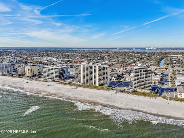 birds eye view of property featuring a view of the beach and a water view