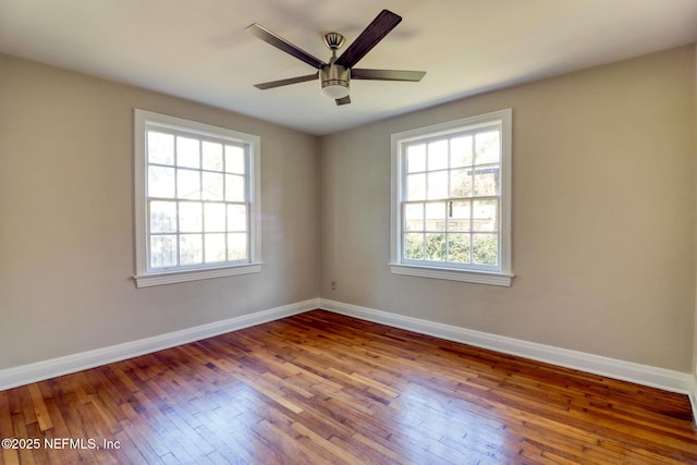 spare room featuring ceiling fan and wood-type flooring