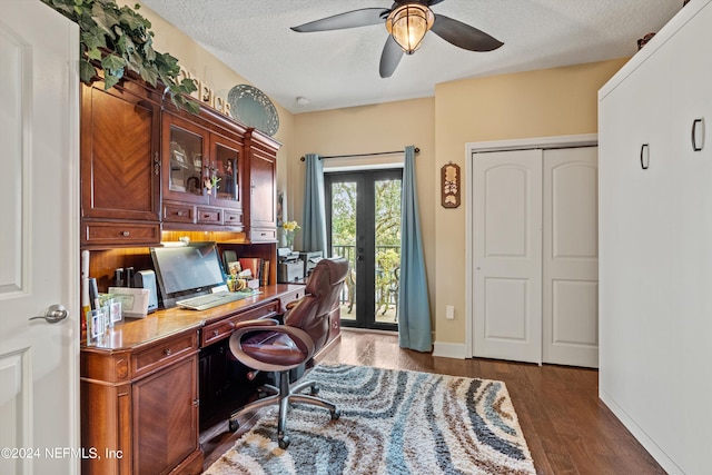 office area featuring french doors, dark hardwood / wood-style flooring, a textured ceiling, and ceiling fan