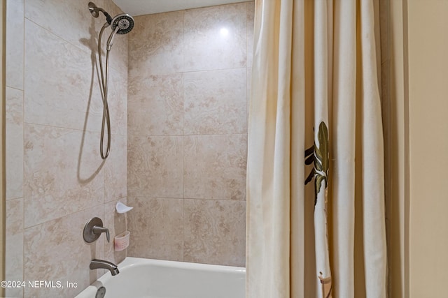 bathroom with shower / bath combination with curtain