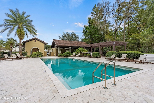 view of pool featuring a pergola and a patio area