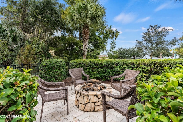 view of patio / terrace with an outdoor fire pit