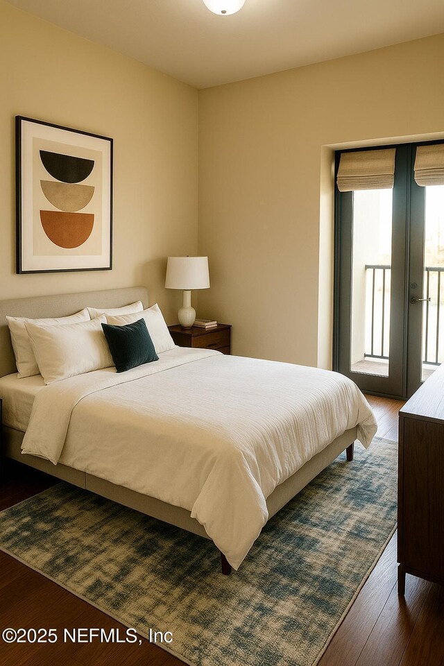 3958 Baymeadows Rd Unit 1204, Jacksonville, FL 32217 - bedroom featuring wood finished floors and access to outside
