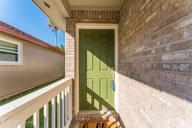 doorway to property with a balcony