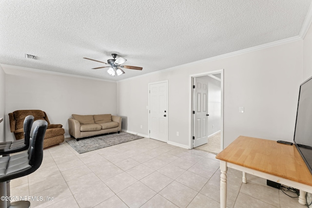 tiled living room featuring crown molding, ceiling fan, and a textured ceiling