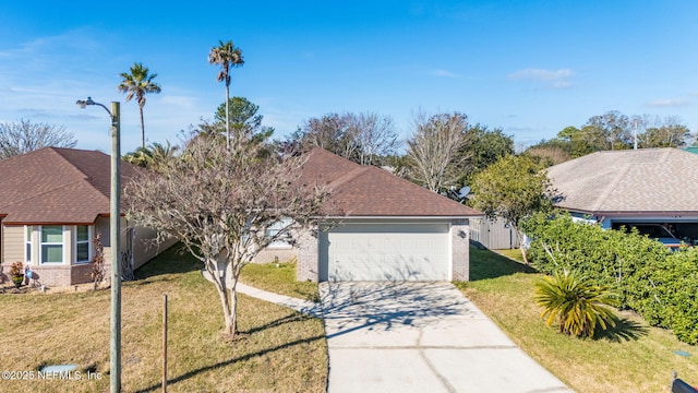 view of front of house with a garage and a front yard