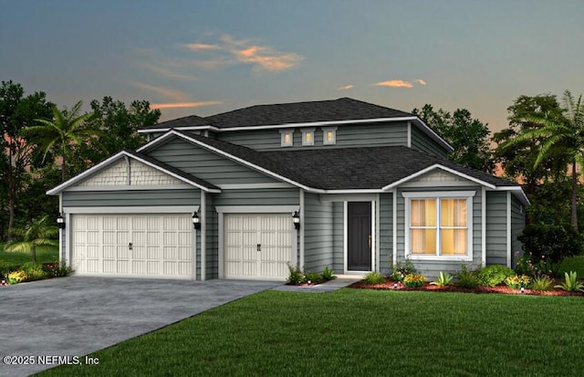 view of front of home featuring a garage and a lawn