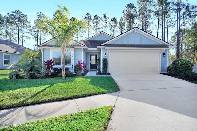 view of front of house featuring a front yard and a garage