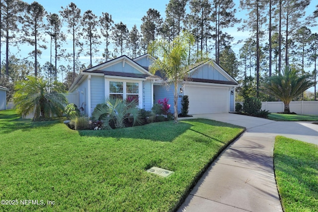 view of front facade featuring a garage and a front yard