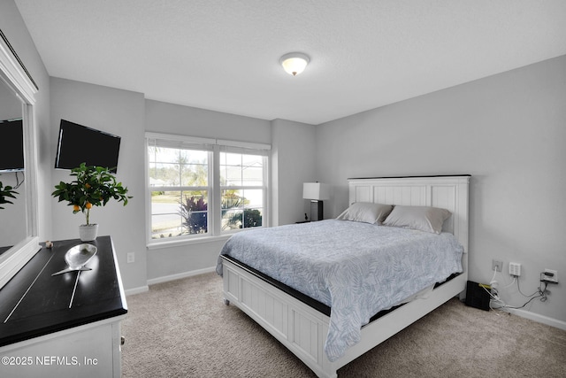 bedroom with light carpet