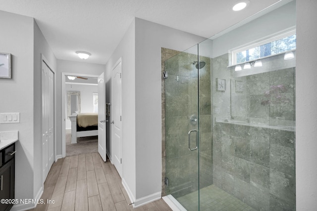 bathroom with vanity and a shower with shower door